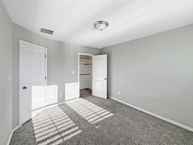 a bathroom with a double vanity sink toilet and shower