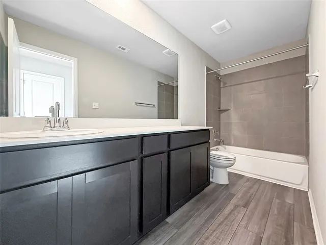 an empty room with a empty space and windows