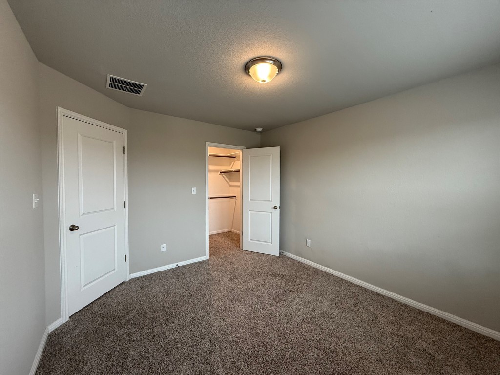 953 Lone Peak Way Dripping Springs, TX 78620 - Photo 21 of 35 Secondary Bedroom with Closet