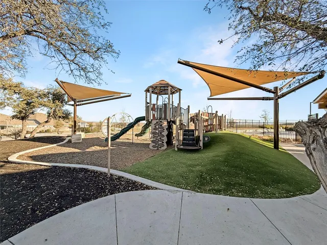 a view of a swimming pool with an outdoor seating