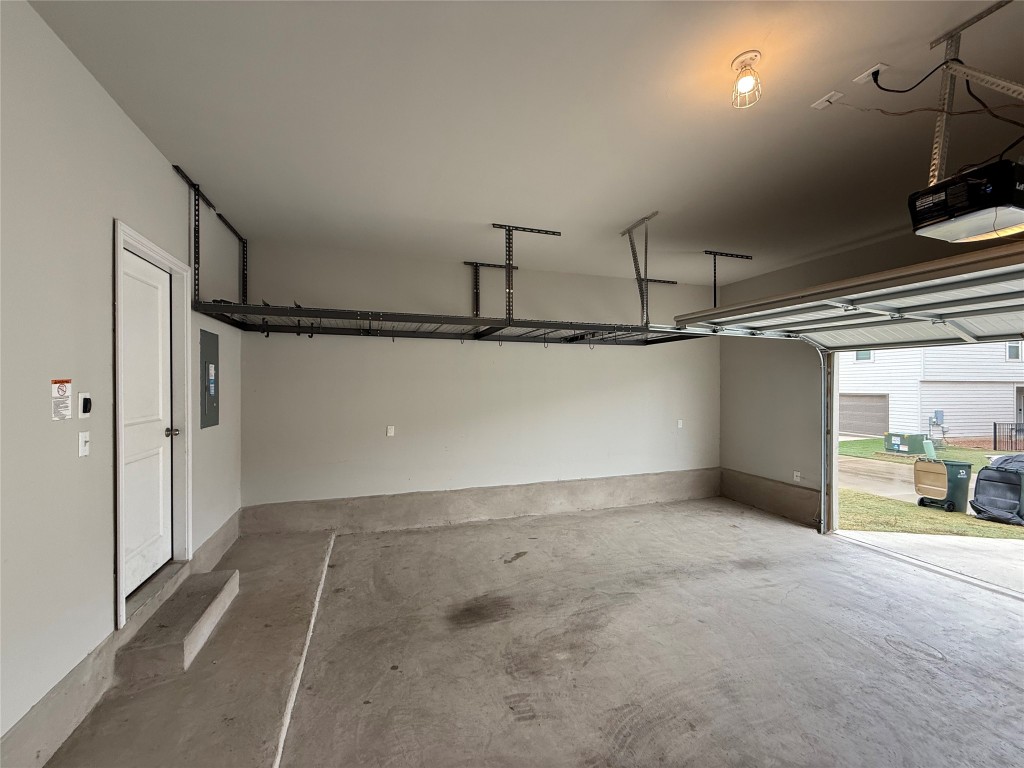 953 Lone Peak Way Dripping Springs, TX 78620 - Photo 28 of 35 Garage With Storage Rack