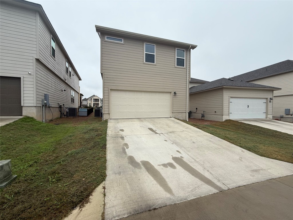 953 Lone Peak Way Dripping Springs, TX 78620 - Photo 30 of 35 Driveway Leading to the Garage