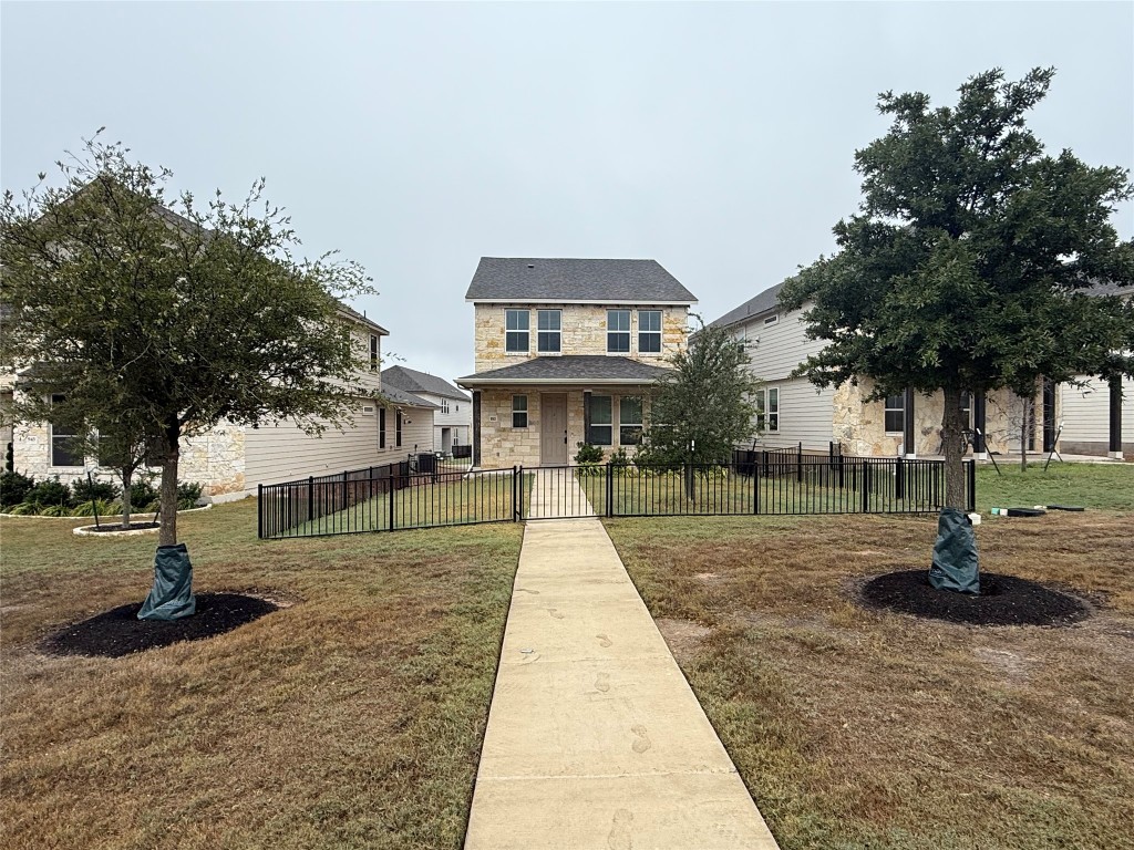 953 Lone Peak Way Dripping Springs, TX 78620 - Photo 3 of 35 Front Of Home Featuring Fenced Yard