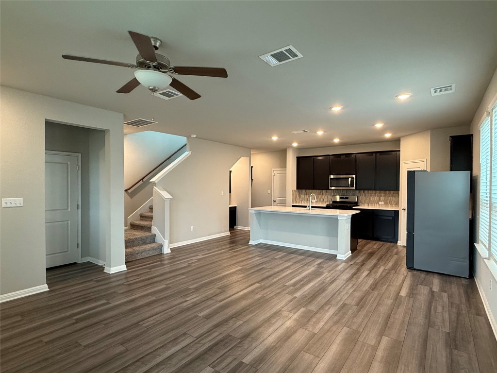 953 Lone Peak Way Dripping Springs, TX 78620 - Photo 5 of 35 Living Room Leading to the Kitchen with an Open-Concept Living Space.