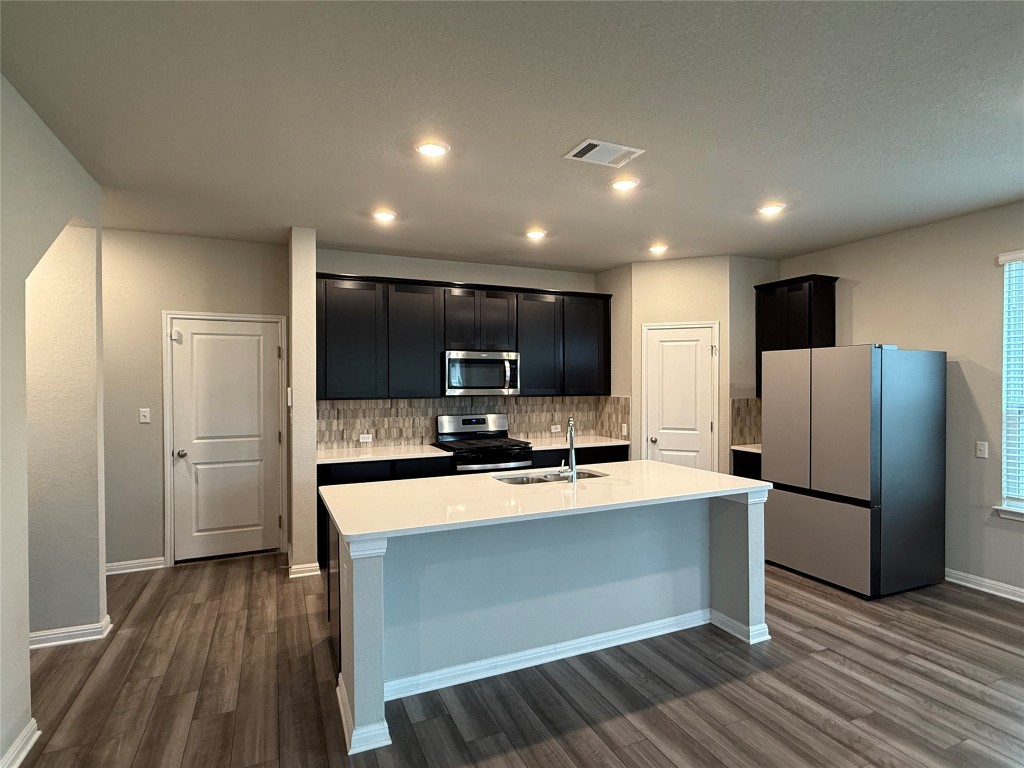 953 Lone Peak Way Dripping Springs, TX 78620 - Photo 6 of 35 Kitchen (Refrigerator there for tenant use but not maintained by the landlord.)