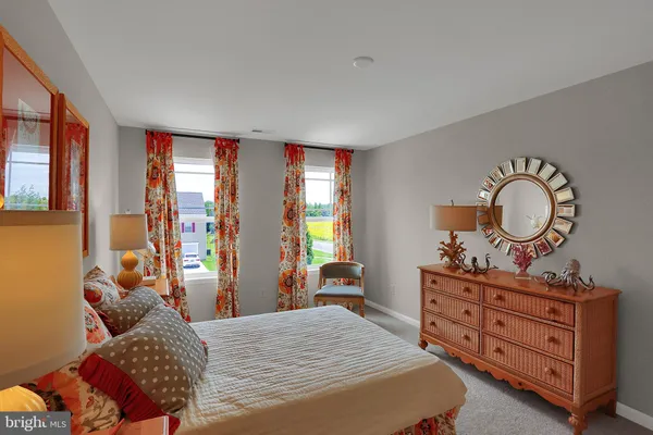 a bedroom with bed and window