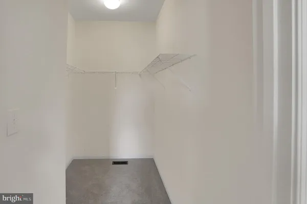 a bathroom with a bathtub a sink and a mirror