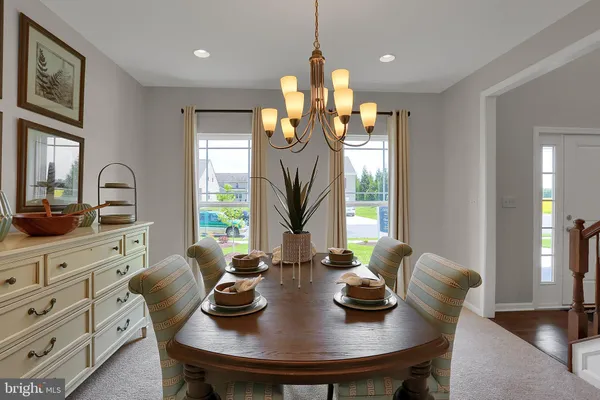 a view of a dining room with furniture and window