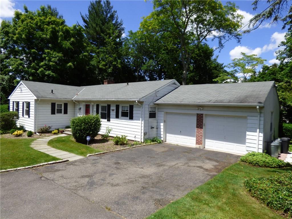32 Stonehouse Road Scarsdale, NY 10583 - Photo 1 of 1 a front view of a house with a yard and garage