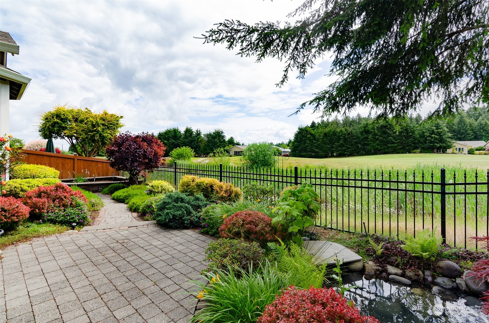 8401 Orcas Loop Northeast Lacey, WA 98516 - Photo 3 of 40 a view of a garden with a fountain