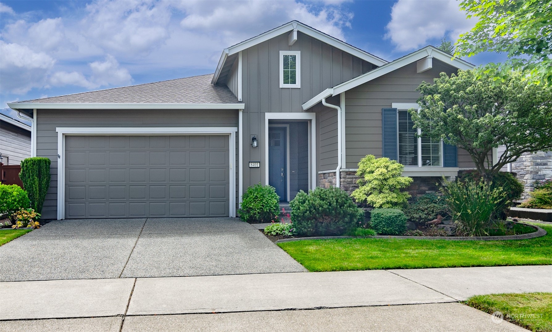 8401 Orcas Loop Northeast Lacey, WA 98516 - Photo 35 of 40 a front view of a house with a garden
