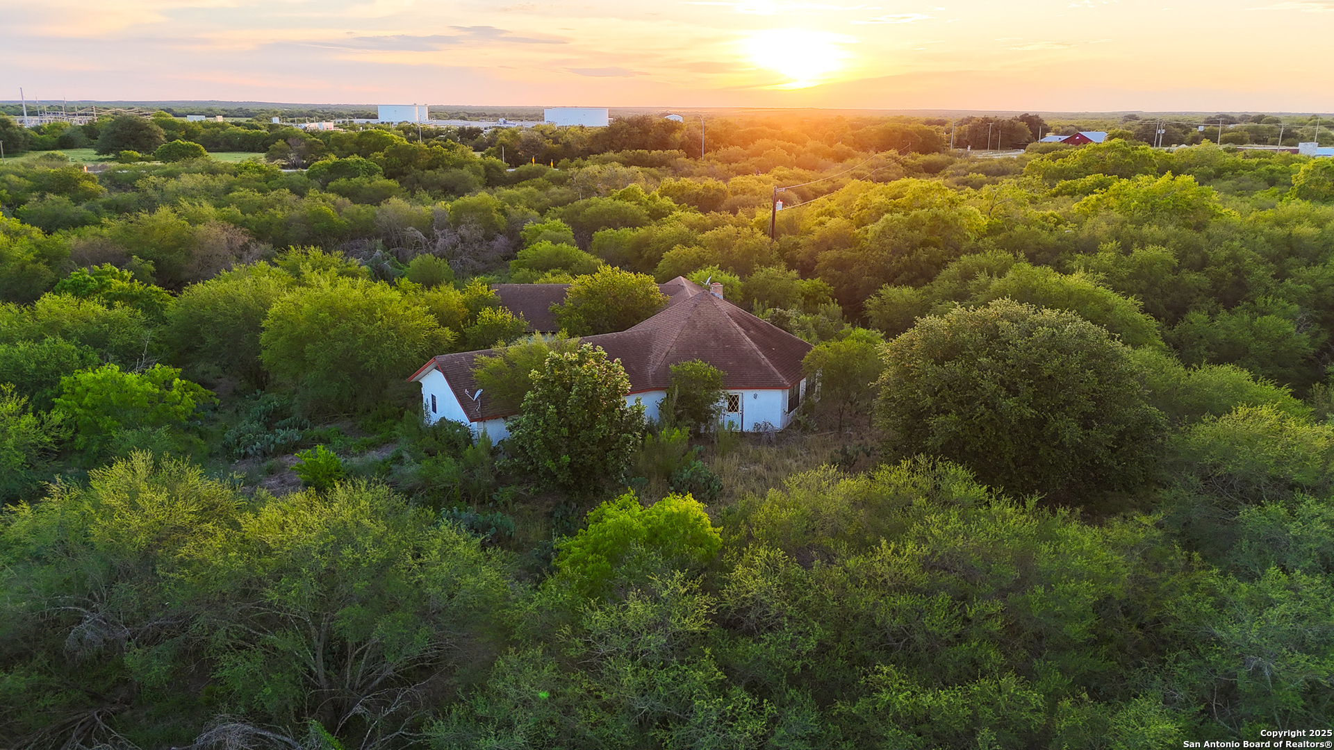 6266 Highway 281 Three Rivers, TX 78071 - Photo 12 of 37 an aerial view of residential houses with outdoor space and trees