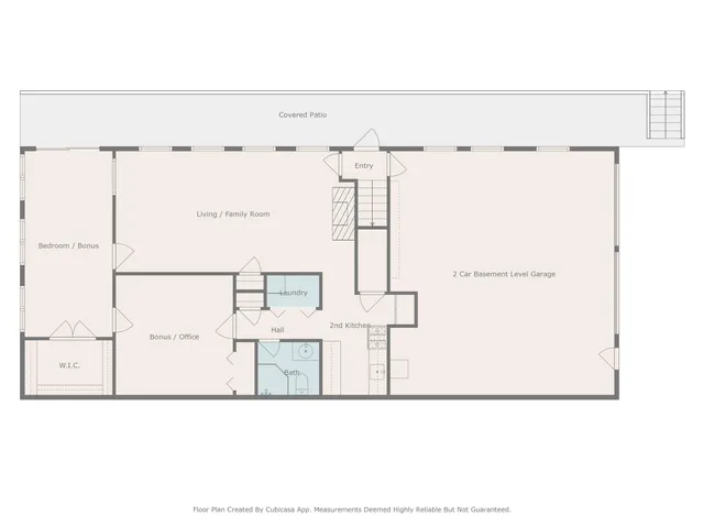 a living room with furniture a fireplace and a large window