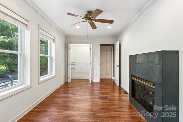 a view of a livingroom with a ceiling fan and window