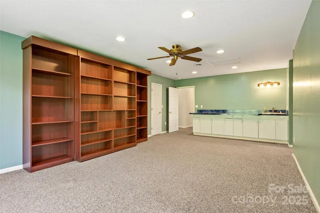 a kitchen with stainless steel appliances granite countertop a refrigerator and a stove