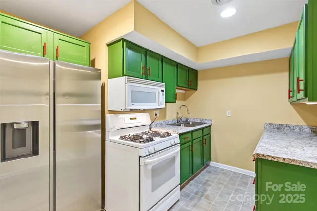 a view of a hallway with washer and dryer