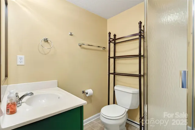 a view of a balcony with yard