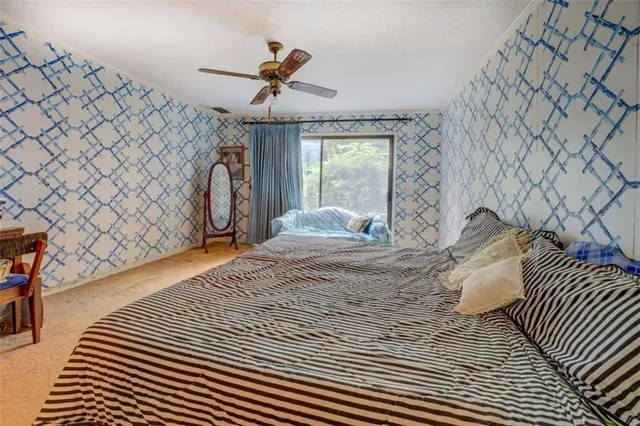 a bed room with a bed and a chandelier