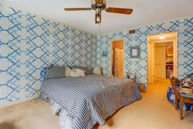 a bedroom with a bed and a cabinets