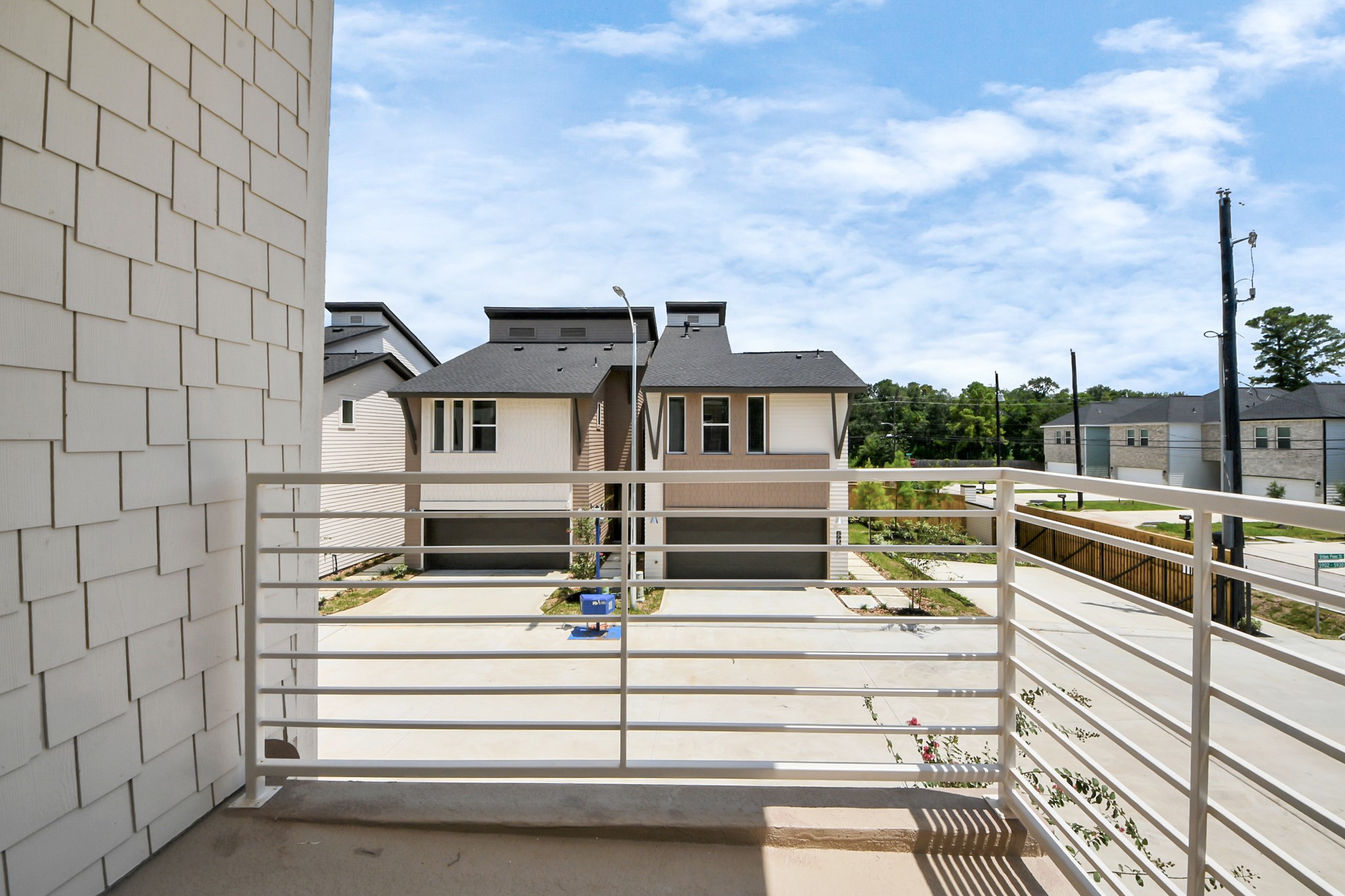 5903 Urban Pines Street Houston, TX 77091 - Photo 38 of 42 a view of a white house with a large windows