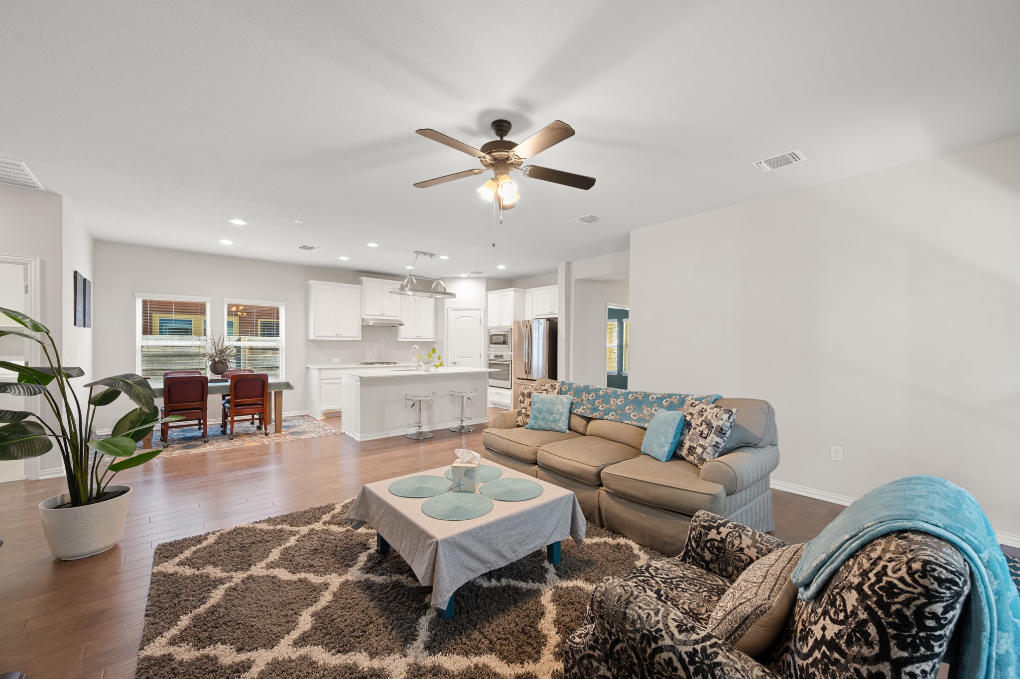 8800 Slater Drive Austin, TX 78747 - Photo 12 of 40 a living room with furniture and wooden floor