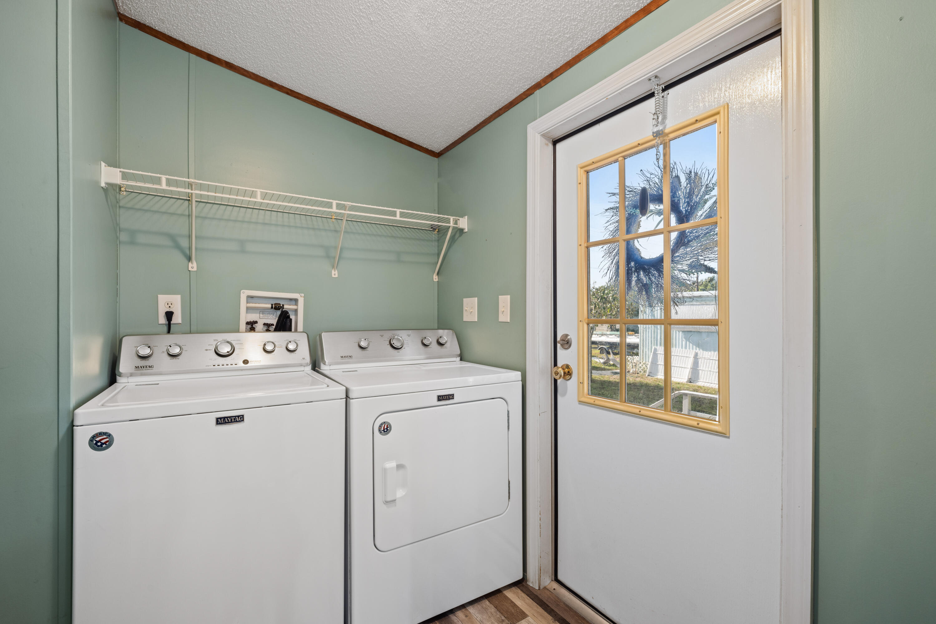 7140 Southeast Ridgeway Terrace Hobe Sound, FL 33455 - Photo 5 of 17 Laundry room