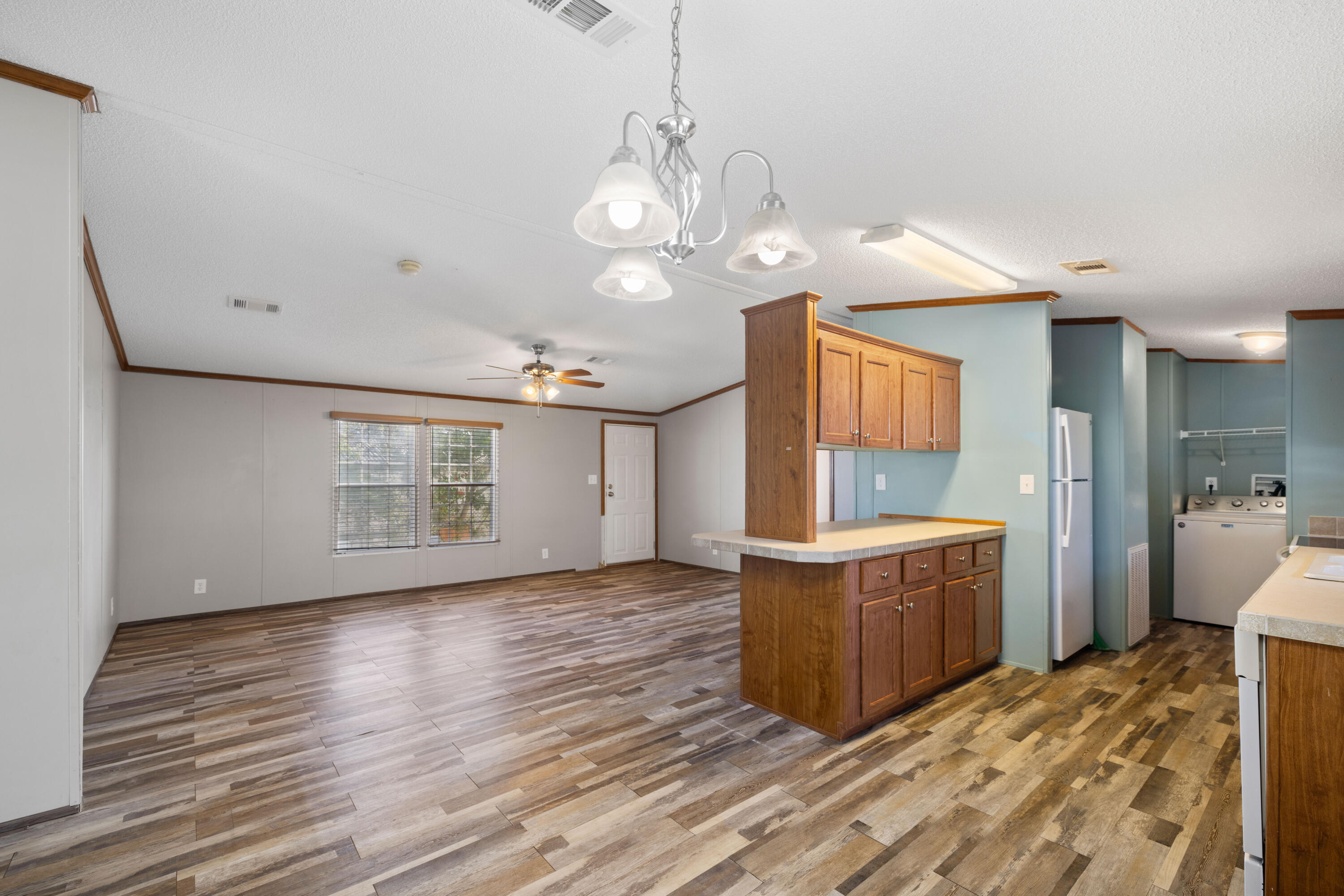 7140 Southeast Ridgeway Terrace Hobe Sound, FL 33455 - Photo 6 of 17 Living room view from dining area