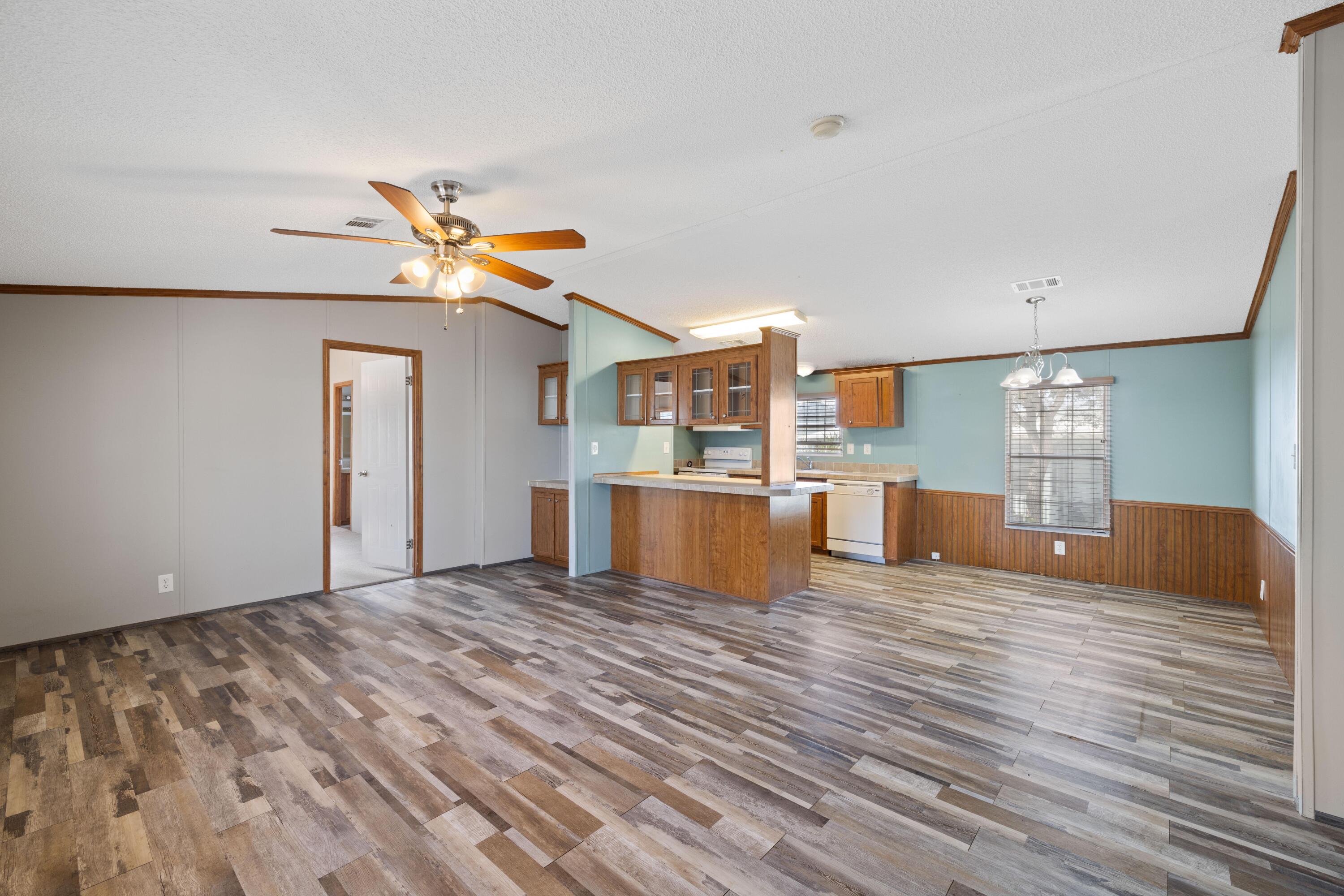 7140 Southeast Ridgeway Terrace Hobe Sound, FL 33455 - Photo 7 of 17 Living room with view of kitchen bar