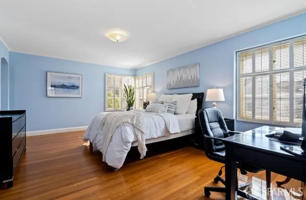 a bed room with a bed and a window
