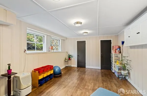 a bedroom with furniture and a window