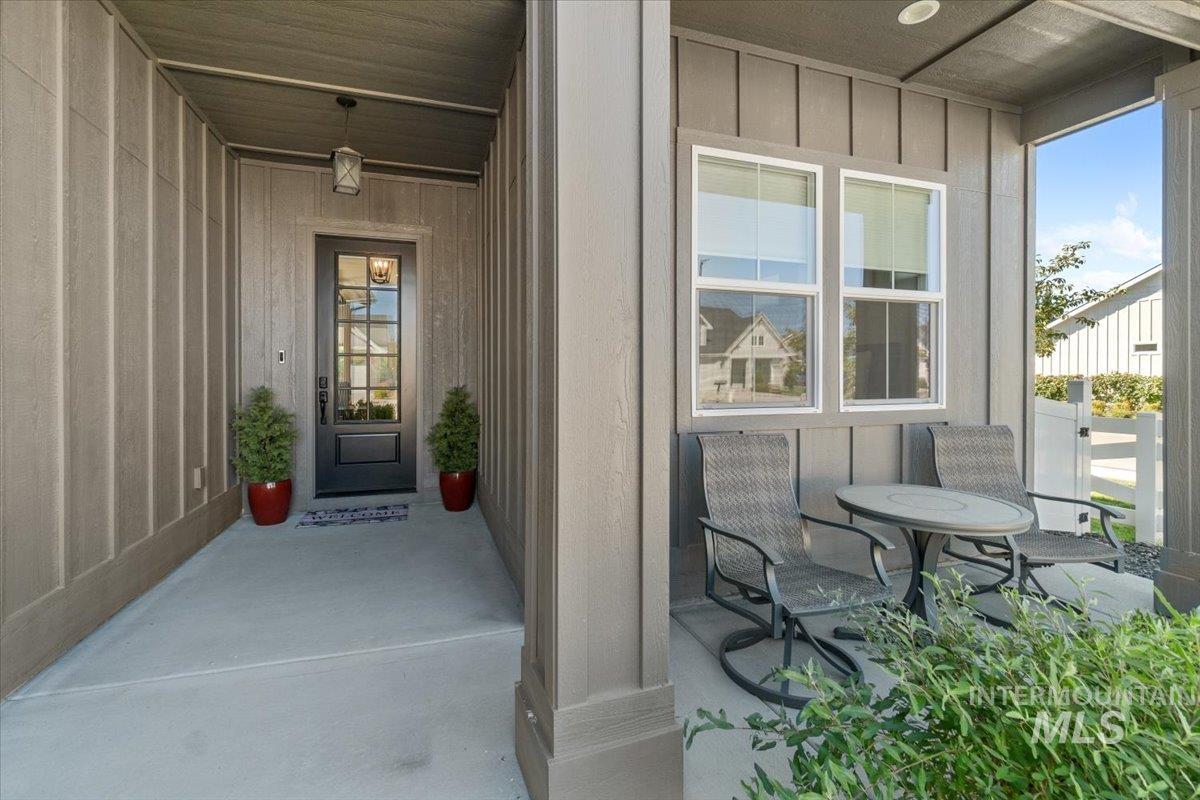 207 West Wrangler Street Meridian, ID 83646 - Photo 6 of 44 View of exterior entry featuring board and batten siding