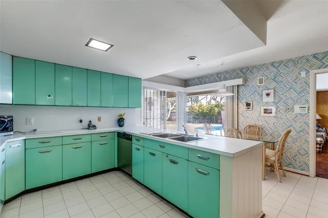 a kitchen with a sink and cabinets