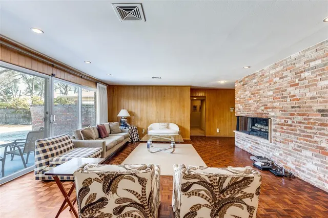 a spacious bedroom with a bed and a fireplace