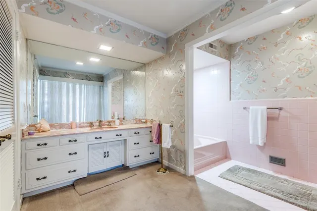 a bathroom with a double vanity sink mirror and double
