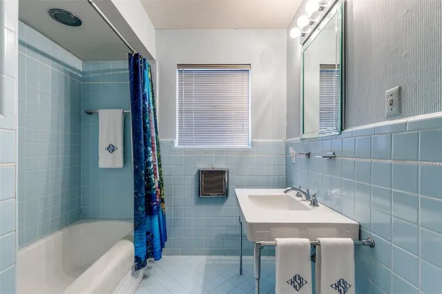 a bathroom with a sink and a bathtub