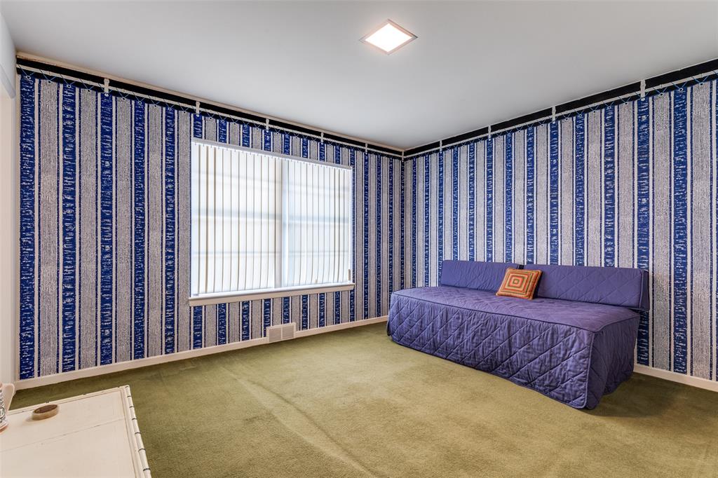 7215 Currin Drive Dallas, TX 75230 - Photo 26 of 35 a large bedroom with a bed and a window