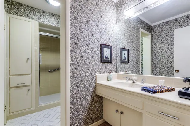 a bathroom with a bathtub sink and mirror
