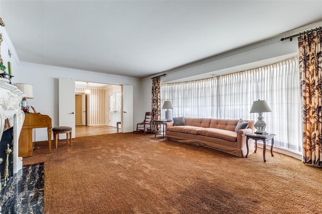 7215 Currin Drive Dallas, TX 75230 - Photo 5 of 35 a living room with furniture and a window