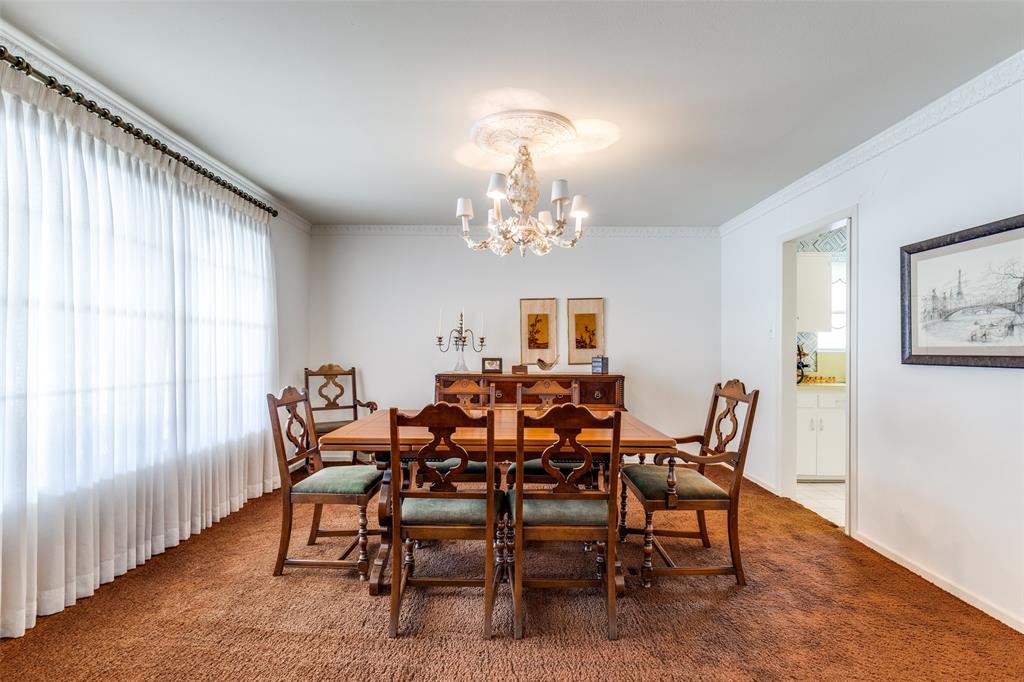 7215 Currin Drive Dallas, TX 75230 - Photo 7 of 35 a view of a dining room with furniture and chandelier