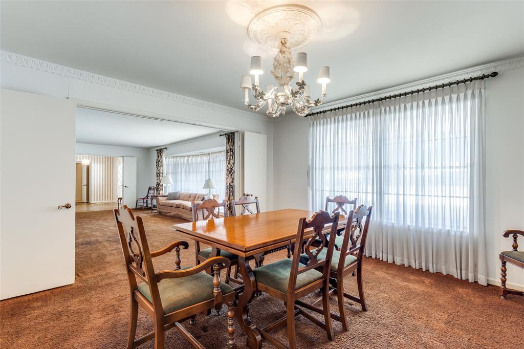 7215 Currin Drive Dallas, TX 75230 - Photo 8 of 35 a view of a dining room with furniture and chandelier