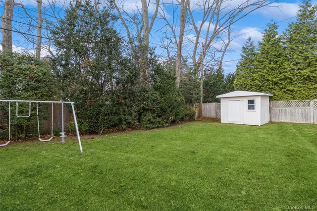 a backyard of a house with trampoline and trampoline