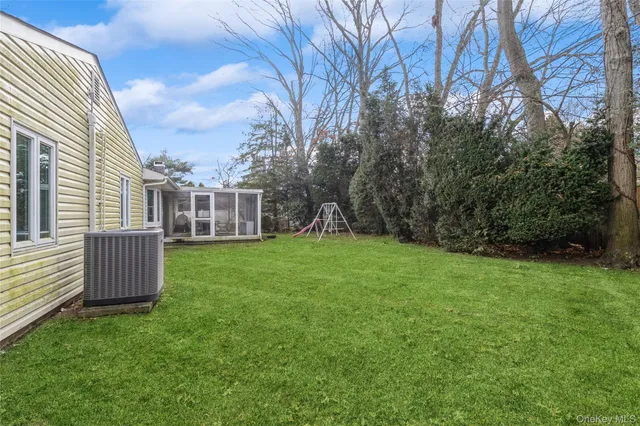 a backyard of a house with lots of green space