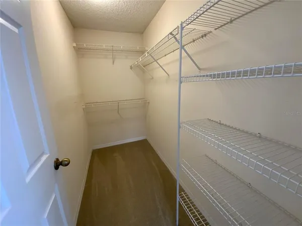 a view of a room with racks on the wall