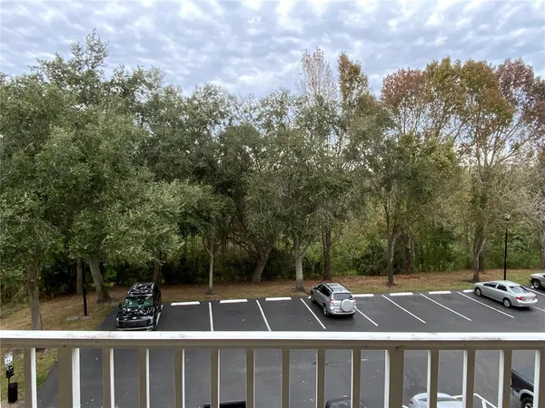 a view of roof with two chairs and a table