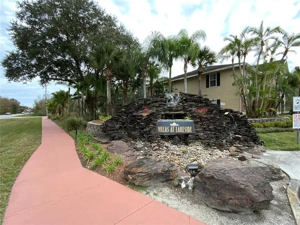 a backyard of a house with yard and outdoor seating