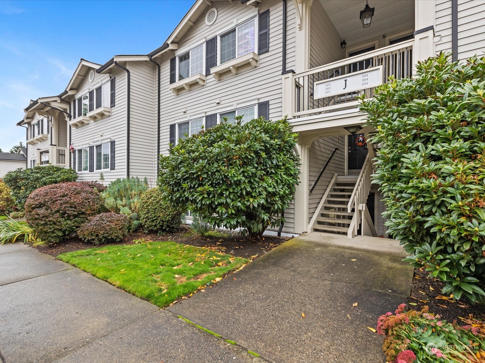 12404 East Gibson Road, Unit J303 Everett, WA 98204 - Photo 1 of 40 a view of a front of house with a yard