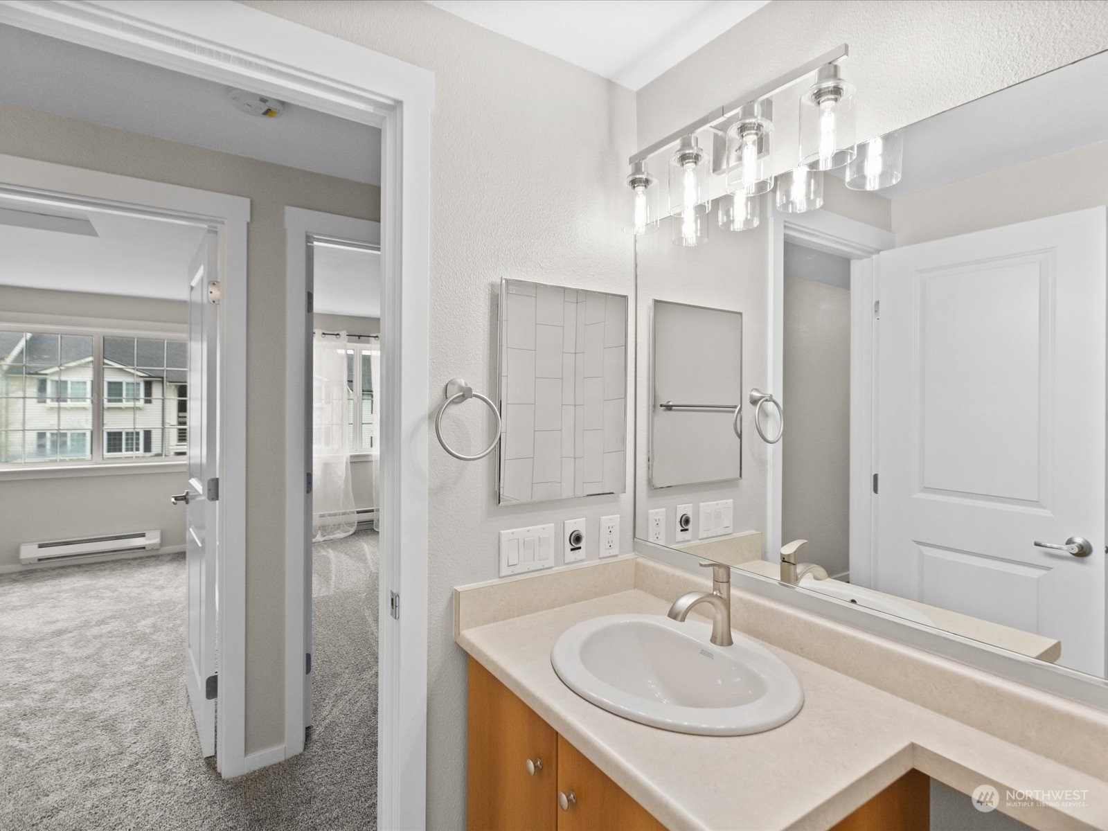12404 East Gibson Road, Unit J303 Everett, WA 98204 - Photo 14 of 40 a bathroom with a sink double vanity and a mirror