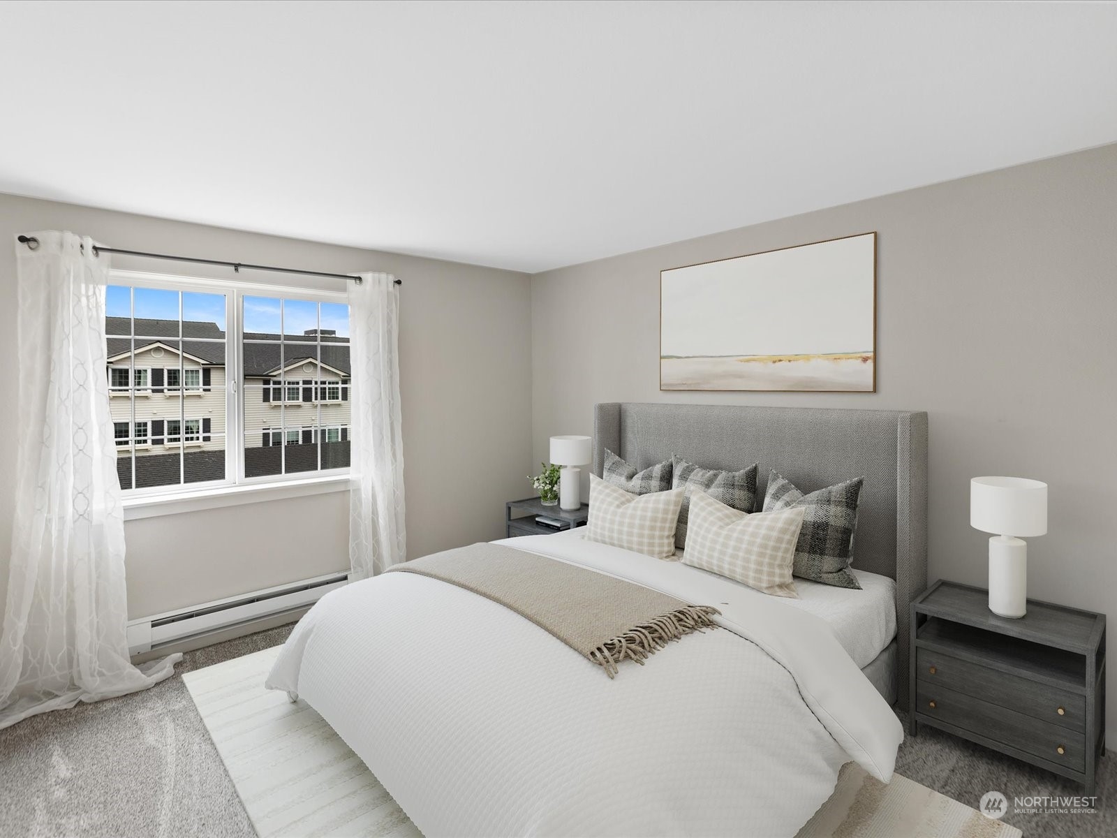12404 East Gibson Road, Unit J303 Everett, WA 98204 - Photo 15 of 40 a bedroom with a bed and a large window