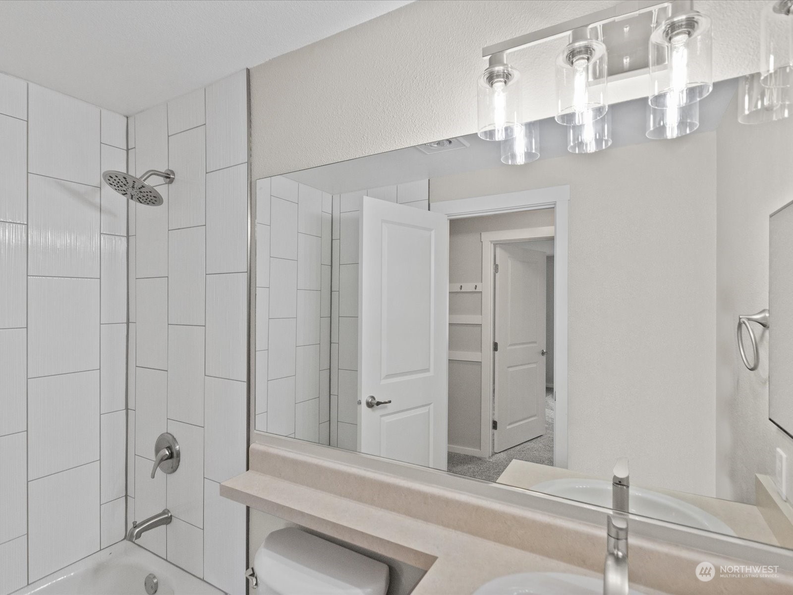 12404 East Gibson Road, Unit J303 Everett, WA 98204 - Photo 17 of 40 a bathroom with a sink and a mirror