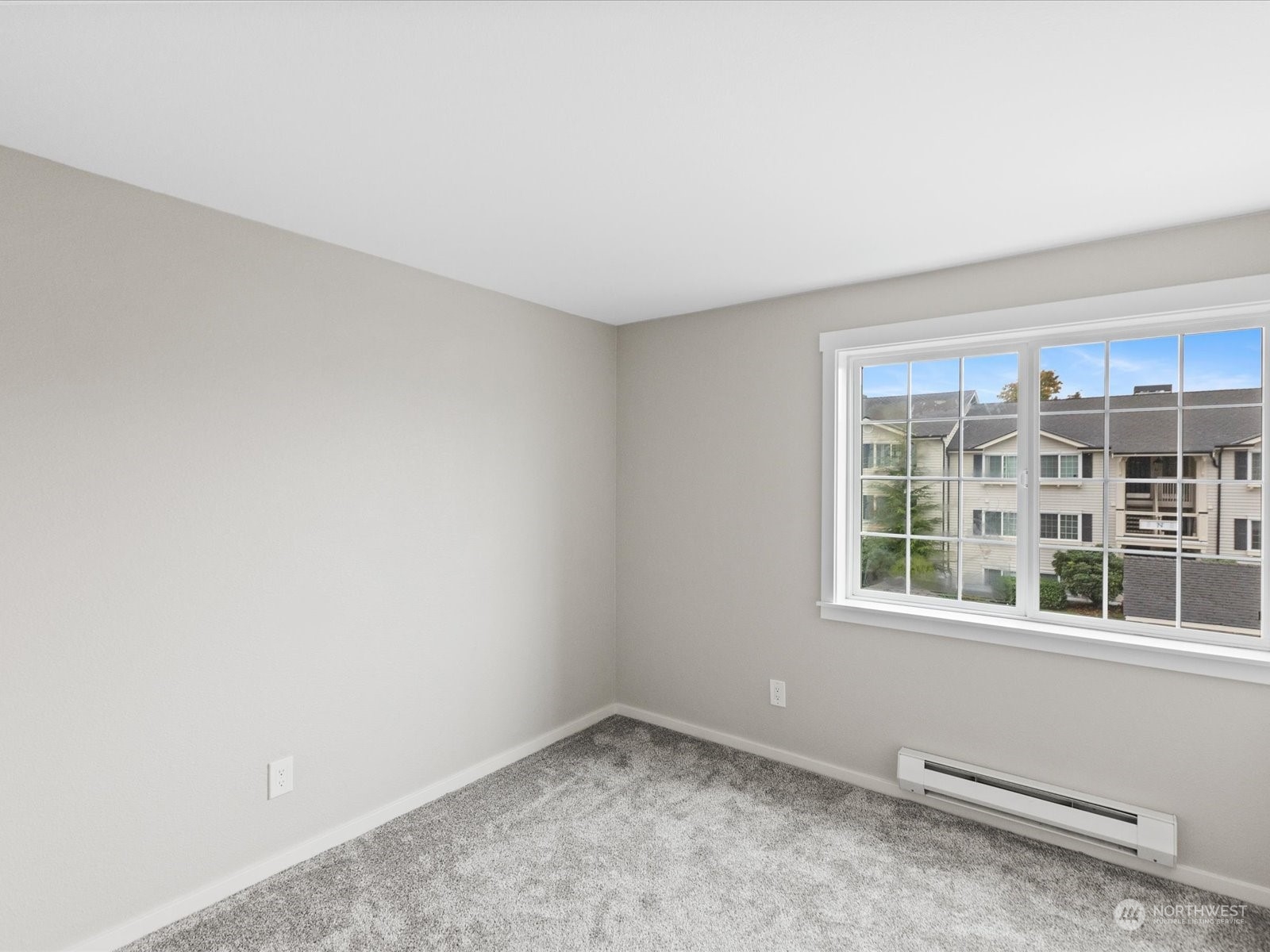 12404 East Gibson Road, Unit J303 Everett, WA 98204 - Photo 21 of 40 a view of an empty room with a window